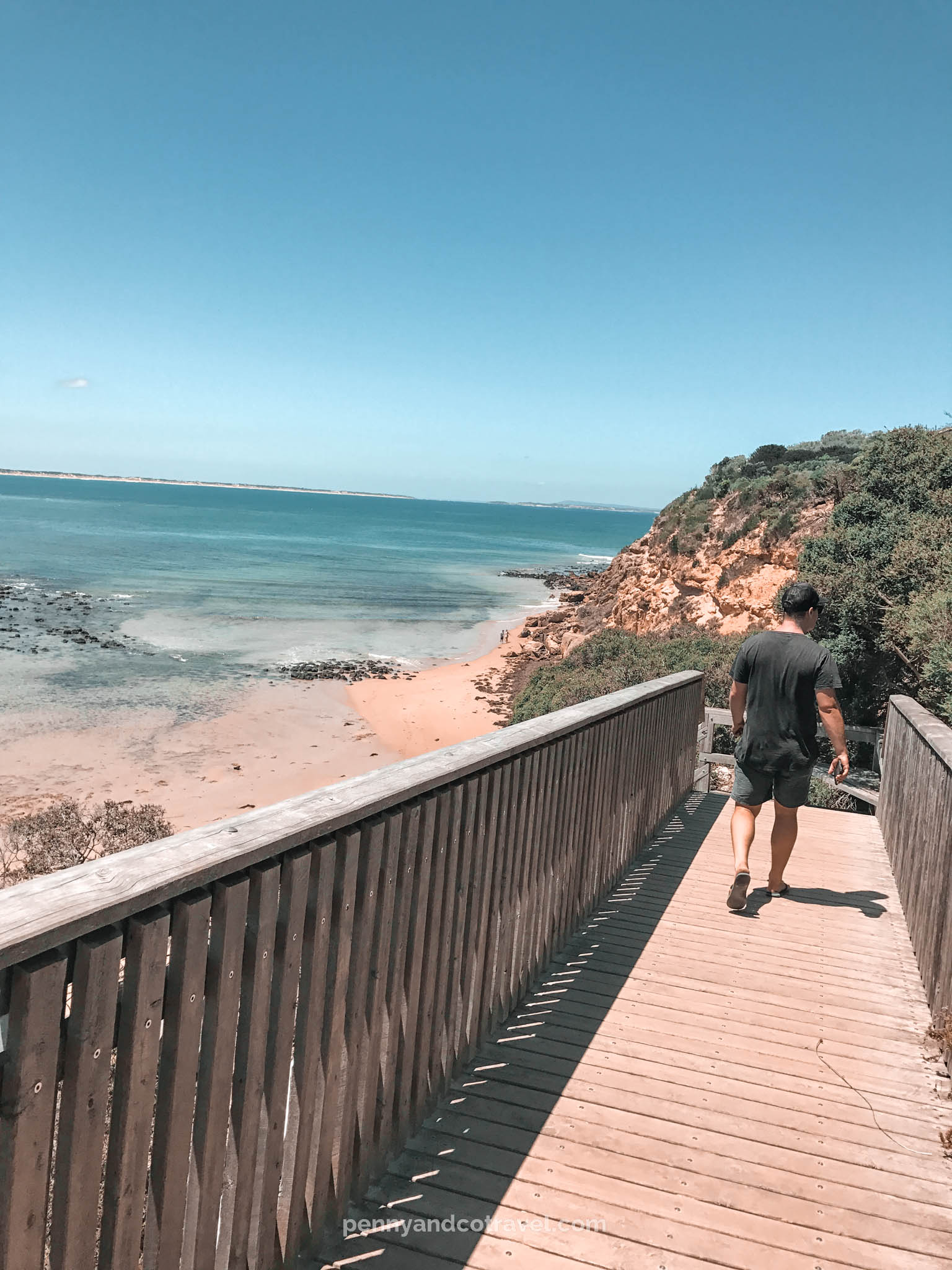 Things to do on the great ocean road > Barwon Heads Bluff Walk > Man walking down the path of the bluff walk.